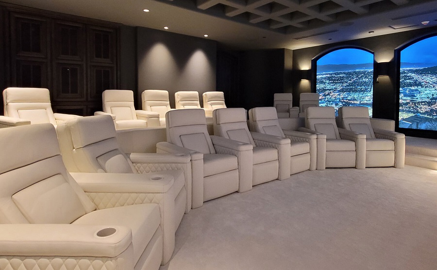 White Fortress seating in a home theater with LED video walls in the background. 
